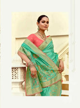 India Silk Sea Green Presents A Pure Viscose Saree Featuring A Delicately Hand-Worked Body That Showcases Exquisite Craftsmanship